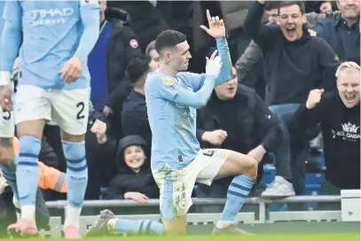  ?? Picture: AFP ?? DESTROYER. Manchester City’s Phil Foden celebrates after scoring a goal during their English Premier League against Manchester United at the Etihad yesterday.