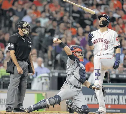  ?? Elizabeth Conley / Houston Chronicle ?? Astros shortstop Marwin Gonzalez (9) might have been airing a grievance after Tigers catcher Alex Avila received a called third strike in the third inning Wednesday night. It was one of five strikeouts for Detroit starter Daniel Norris.