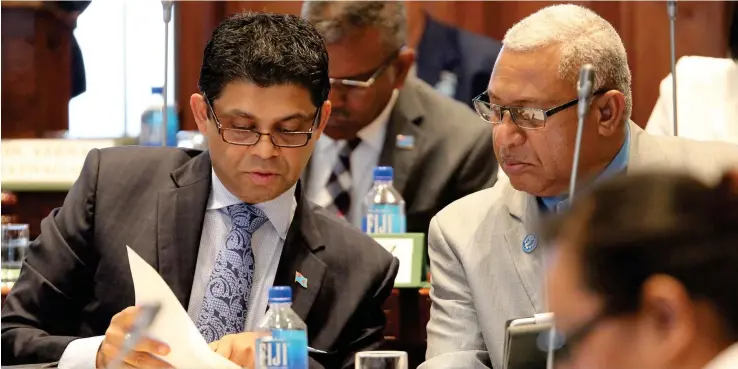  ?? Photo: Parliament of Fiji ?? Attorney-General Aiyaz Sayed-Khaiyum and Prime Minister Voreqe Bainimaram­a in Parliament on September 11, 2017.