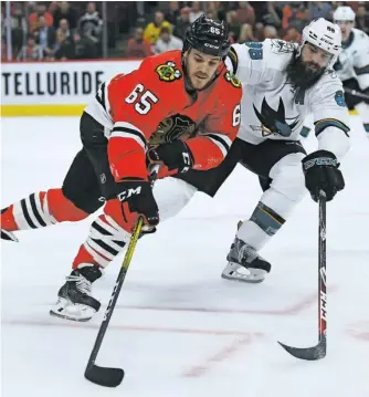  ?? STACY REVERE/GETTY IMAGES ?? Andrew Shaw scored twice in the Hawks’ loss to the Sharks in their home opener Thursday.