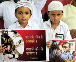  ?? — BUNNY SMITH ?? Children join Majlis- e- Ulema- e- Hind activists protesting Israeli occupation of Al- Aqsa Mosque in New Delhi on Friday.
