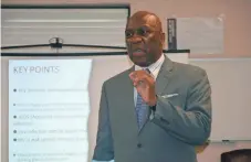  ??  ?? The University of Alabama’s Edward Jackson discusses HIV cases among blacks at a Christian education conference.
