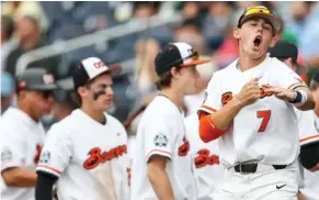  ?? (Photo by Rebecca S. Gratz, Omaha World-Herald, AP) ?? Oregon State's Tyler Malone (7) celebrates a two-run single by Trevor Larnach against Cal State Fullerton on Saturday.