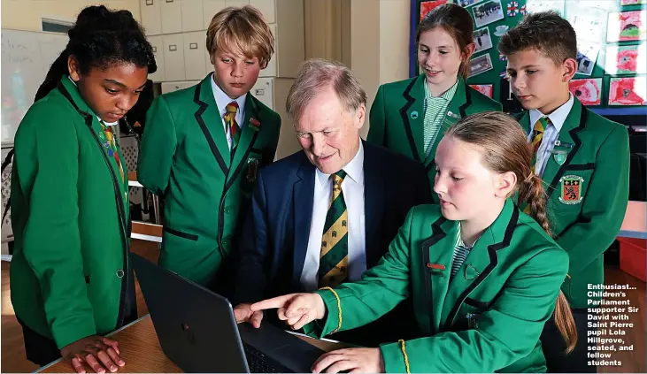  ?? Picture: JONATHAN BUCKMASTER ?? Enthusiast... Children’s Parliament supporter Sir David with Saint Pierre pupil Lola Hillgrove, seated, and fellow students