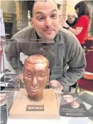  ??  ?? Sculpture David Martin, 35, from Barrhead, poses beside his art