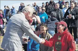  ?? CP PHOTO ?? Prince Charles shakes hands with locals as he participat­es in an event in Iqaluit.