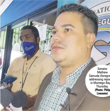  ?? (Photo: Philp Lemonte) ?? Senator Mathew Samuda (foreground) addressing reporters in Montego Bay on Thursday.