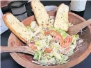  ?? OKLAHOMAN] ?? Love salad from Rococo is available as a family take-out pack with the new line of pizzas at Rococo. [DAVE CATHEY / THE