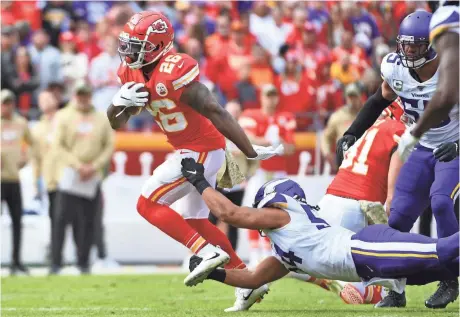  ?? DENNY MEDLEY/USA TODAY SPORTS ?? Chiefs running back Damien Williams is tackled by Vikings middle linebacker Eric Kendricks but he finished the game with 125 yards and a TD on 12 carries Sunday.