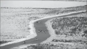  ?? JAMES MACKENZIE, THE CANADIAN PRESS ?? Constructi­on takes place on the Inuvik-Tuktoyaktu­k highway in Inuvik, N.W.T. The new 120-kilometre all-weather gravel road opens Wednesday.