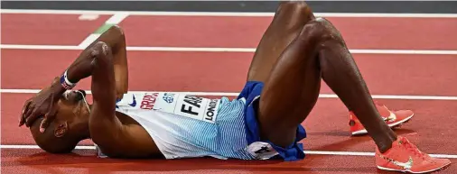  ?? — AFP ?? The agony: Britain’s Mo Farah reacts after finishing second in the final of the men’s 5,000m at the London Stadium on Saturday. Below: Jamaica’s Usain Bolt falls after suffering an injury in the men’s 4x100m relay final.