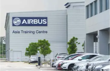  ??  ?? This photograph shows the exterior of the Airbus Asia Training Centre facility in Singapore’s Seletar Aerospace Park. Airbus and Boeing may have built their global success on the back of the transconti­nental airliners but they are now eyeing a...