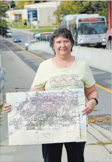  ?? JOHN RENNISON THE HAMILTON SPECTATOR ?? Anita Joldersma shows her map that she has used to track her walks along every street in Hamilton (pre-amalgamati­on).