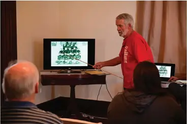  ?? Staff photo by Hunt Mercier ?? ■ Eddie Ray Shuffield speaks Saturday about the history of the rivalry of Arkansas High School and Texas High School during a presentati­on titled “Before They Were Razorbacks” at the P.J. Ahern House in Texarkana, Ark.