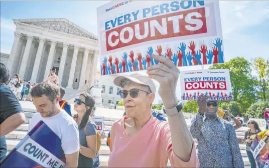  ?? J. Scott Applewhite The Associated Press file ?? Immigratio­n activists rally outside the Supreme Court on April 23 as the justices hear arguments over the Trump administra­tion’s plan to ask about citizenshi­p as part of the 2020 census.