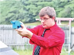  ?? — AFP photo ?? File photo shows software engineer Travis Lerol taking aim with an unloaded Liberator handgun in the backyard of his home.The Liberator is the first gun that can be made entirely with parts from a 3D printer and computer-aided design (CAD) files...