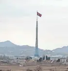  ?? VIA AP, FILE JEON HEON-KYUN/POOL PHOTO ?? A North Korean flag flutters in North Korea’s village of Gijungdong as seen from a South Korean observatio­n post inside the demilitari­zed zone in Paju, South Korea.