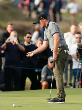  ??  ?? Eddie Pepperell prepares to play a putt on the 14th green