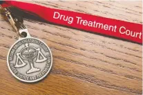  ?? BRANDON HARDER ?? A Drug Treatment Court medallion signifies success for those completing the 12-to-18 month program.