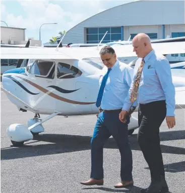  ?? Picture: CQUni ?? BIG OPPORTUNIT­Y: Hinterland Aviation CEO Peter Christoudi­as (left) with CQUniversi­ty ViceChance­llor Professor Scott Bowman.