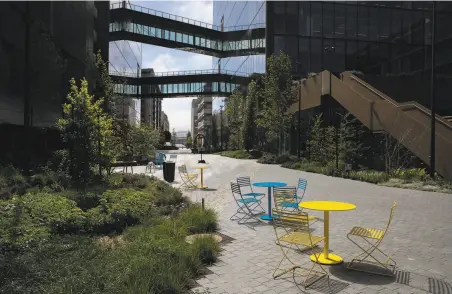  ?? Santiago Mejia / The Chronicle ?? Colorful tables and chairs line Pierpoint Lane between Third Street and Bridgeview Way at Uber’s new headquarte­rs.
