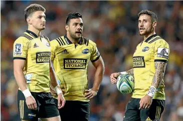 ?? GETTY IMAGES ?? Hurricanes fullback Chase Tiatia, centre, says playing alongside the likes of Beauden Barrett, left, and TJ Perenara has helped him considerab­ly. ‘‘I’ve learned so much in these last three weeks,’’ he says.
