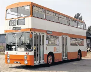  ??  ?? ●●A Greater Manchester Transport orange bus from the early 1970s