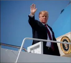  ??  ?? President Donald Trump waves as he boards Air Force One for a trip to new York to attend a fundraiser, on Thursday at Andrews Air Force base, Md. AP PhoTo/EVAN VuccI