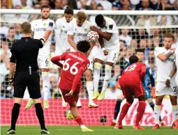  ?? (Reuters) ?? LIVERPOOL DEFENDER Trent Alexander-Arnold shoots at goal from a free kick during the Reds’ 3-0 away victory at Leeds United last night in Premier League action.