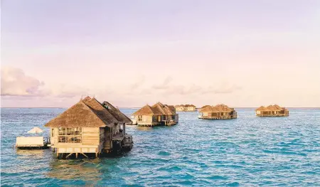  ?? JON INGALL/DREAMSTIME ?? The Crusoe Villas at Gili Lankanfush­i in the Maldives.