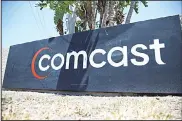  ??  ?? In this file photo, a Comcast sign is seen in Miami,Florida. US cable giant Comcast on Oct 9 said it is the majority shareholde­r of pan-European TV satellite group Sky after purchasing 21st Century Fox’s 39-percent holdingin the group. (AFP)