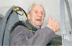  ??  ?? Former fighter pilot Allan Scott, left, gives the thumbs-up after taking to the skies over Biggin Hill in a two-man Spitfire, above, to celebrate the RAF’s centenary yesterday