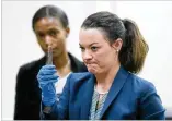  ?? BOB ANDRES / BANDRES@AJC.COM ?? Daniella Stuart, a GBI special agent and crime scene specialist, with Marie Broder, assistant DA, shows the jury part of a knife blade she found in the defendant’s well.