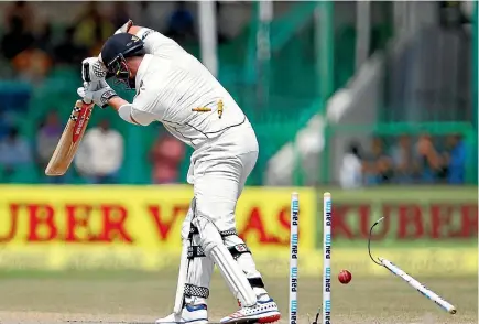  ?? PHOTO: REUTERS ?? Mark Craig is comprehens­ively bowled by Indian pace bowler Mohammad Shami on the final day of the first test at Kanpur.