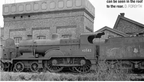  ?? D. FORSYTH ?? BELOW The rear of Uttoxeter depot housed many stored engines with ‘2P’ 4‑4‑0s being prevalent among them. On March 13 1959, weatherbea­ten No. 40583 awaits its final call for scrapping. A hint of the LNWR‑ inspired shed design can be seen in the roof to the rear.