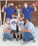  ?? KRISTINA HJERTKVIST/TAMPA BAY LIGHTNING VIA AP ?? Malissa, front left, and Jesse Black, front right, with 5-year-old son Jase and 7-year-old son Mason, pose with the Stanley Cup and Lightning players Steven Stamkos, top left, and Ryan McDonagh, top right, Oct. 16 at the Children’s Cancer Center in Tampa, Fla. The Lightning took the Stanley Cup to the Children’s Cancer Center as part of their local tour of stops after winning the Stanley Cup Sept. 28 in Edmonton, Alberta.