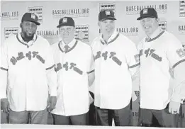  ?? FRANK FRANKLIN II/ASSOCIATED PRESS ?? Baseball Hall of Fame inductees, from left, Vladimir Guerrero, Trevor Hoffman, Chipper Jones and Jim Thome, will be enrshrined today at a ceremony in Cooperstow­n, N.Y.