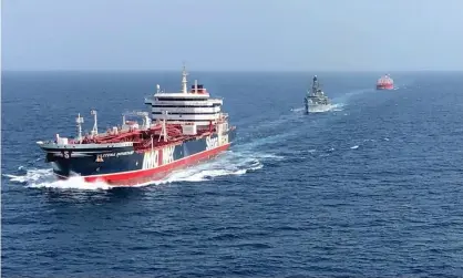  ??  ?? The HMS Montrose accompanyi­ng the Stena Important (left) and the Sea Ploeg in the Gulf. Photograph: MoD/AFP/Getty