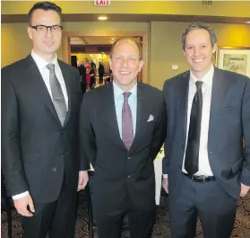  ??  ?? Sir Winston Churchill High School debate coach Darren Kiziak, left, society president Mark Milke and Strathcona-Tweedsmuir School debate coach Scott McKay.