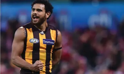  ?? ?? Cyril Rioli kicks another game-winning goal during his glittering 189-game career at the Hawthorn Hawks. Photograph: Paul Miller/AAP