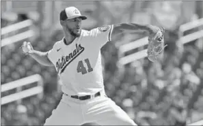  ?? AP ?? In this file photo, Washington Nationals pitcher Joe Ross throws during the first inning of a spring training baseball game against the Miami Marlins, in West Palm Beach, Florida. Longtime infielder Ryan Zimmerman and Ross are opting out of playing the 2020 season as Major League Baseball tries to get back amid the COVID-19 pandemic. General manager Mike Rizzo says the team is 100% supportive of Zimmerman and Ross deciding not to play.