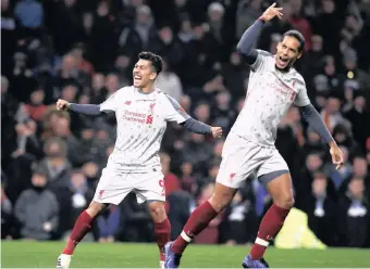  ?? | Reuters ?? LIVERPOOL’S Roberto Firmino came off the bench against Burnley on Wednesday night to score for the title challenger­s, who romped to a 3-1 victory. He has been key in the Reds’ gameplan, along with defender Virgil van Dijk, right.