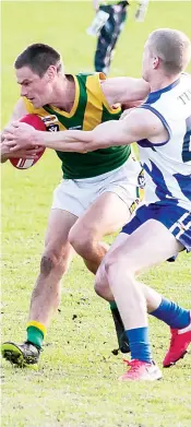  ?? Photograph­s by AMANDA EMARY. ?? Hill End’s Robert Fiddelaers is unable to break the tackle of Tarwin’s Noah Bee-Hickman in Saturday’s senior game.