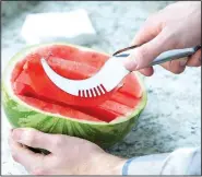  ?? File photo ?? In the days before air conditioni­ng, cold watermelon was a popular summer delicacy in Arkansas. Even now, two upcoming festivals remember the days when watermelon was king.