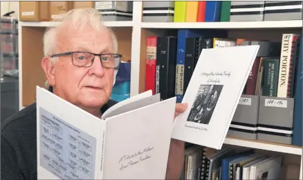  ?? Picture: PAUL CARRACHER ?? CAPTURING HISTORY: Wimmera Associatio­n for Genealogy president Tony Ward with books written by former Noradjuha resident Jack Walter at Horsham Library.