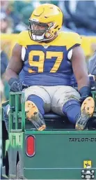  ?? MIKE DE SISTI / MILWAUKEE JOURNAL SENTINEL ?? Packers nose tackle Kenny Clark thought his season was over when he was carted off the field Nov. 19.