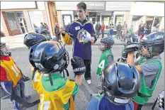  ??  ?? Sandwiched in between their home games last weekend, members of the Yarmouth Jr. A Mariners helped to referee some of the games on Main Street on Saturday.