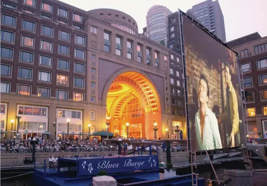  ??  ?? MOVIE NIGHT: The Boston Harbor Hotel shows free movies on the waterfront Friday nights through Aug. 30.