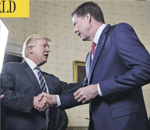  ?? ANDREW HARRER / POOL / GETTY IMAGES FILES ?? U.S. President Donald Trump shakes hands with James Comey, then director of the FBI, at the White House in January 2017. Trump unleashed a volley of tweets criticizin­g Comey as details of his tell-all book come to light.