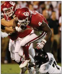  ?? AP/SUE OGROCKI ?? Oklahoma running back Trey Sermon (4) ran for 119 yards on 18 carries in the Sooners’ 28-21 overtime victory over Army on Saturday night.